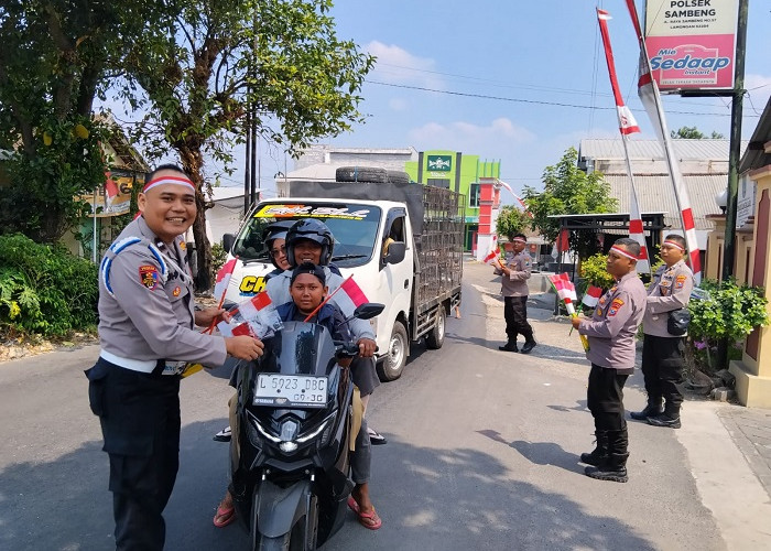 Polres Lamongan Bagikan 2.000 Bendera Merah Putih di 27 Titik Sambut HUT Ke-81 kemerdekaan RI 