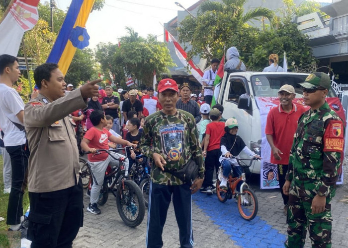 Bhabinkamtibmas dan Babinsa Jalin Keakraban dengan Warga Kebraon Melalui Jalan Sehat HUT RI