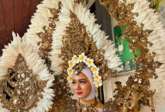 Gaun Bunga Putih Emas Gayatri Alivya Pukau Penonton Surabaya Fashion Festival 2026